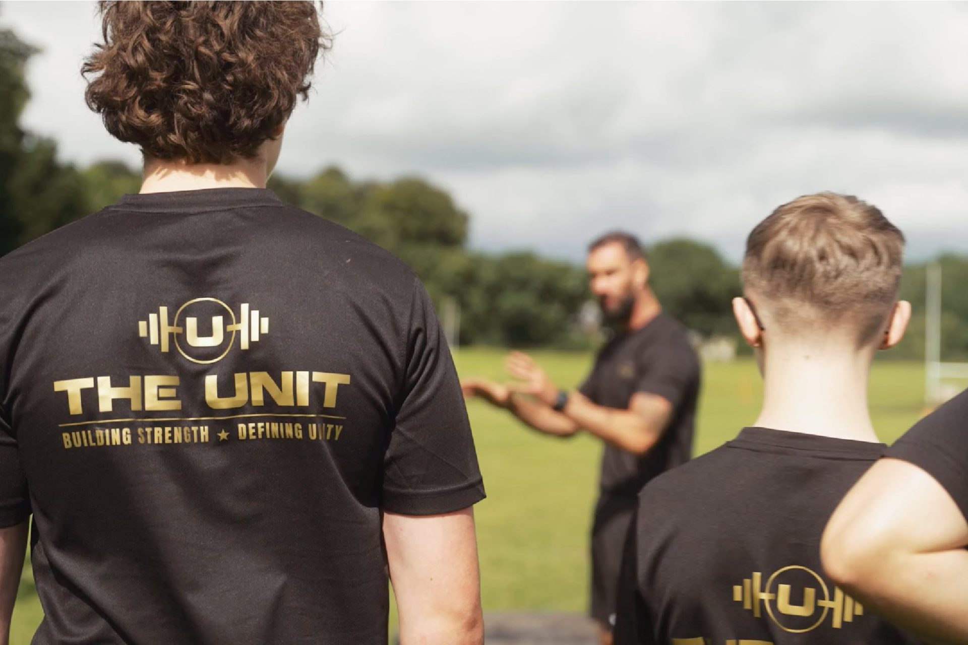 a group of people in black shirts